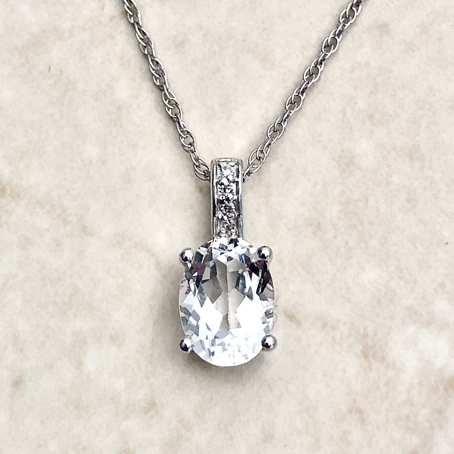 14 Karat White Gold April Birthstone Oval White Topaz & Diamond Pendant Necklace - WeilJewelry