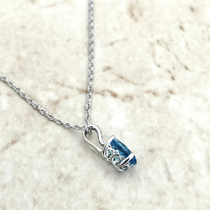 14 Karat White Gold December Birthstone Oval Blue Topaz & Diamond Pendant Necklace - WeilJewelry