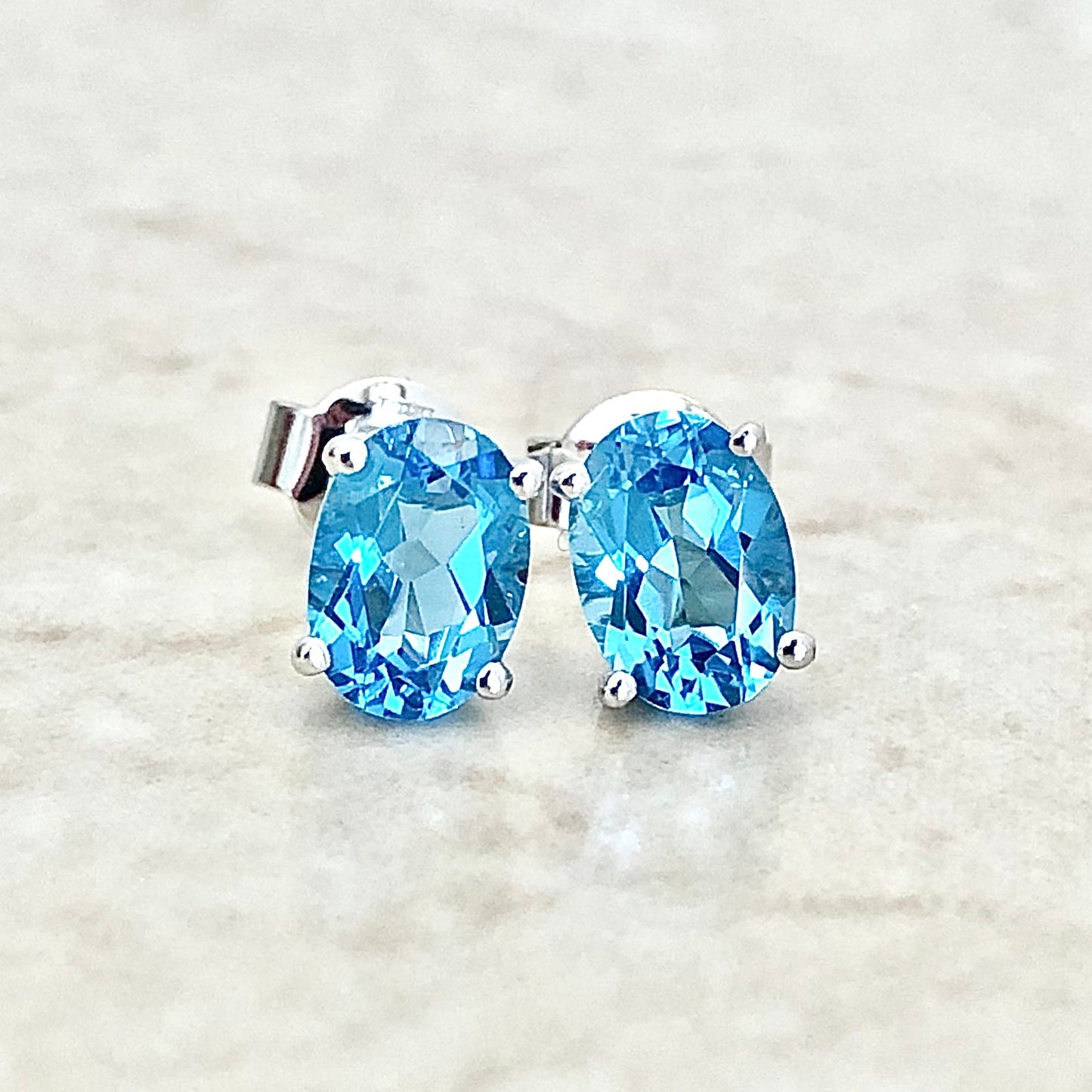 14 Karat White Gold December Birthstone Oval Blue Topaz Stud Earrings - WeilJewelry