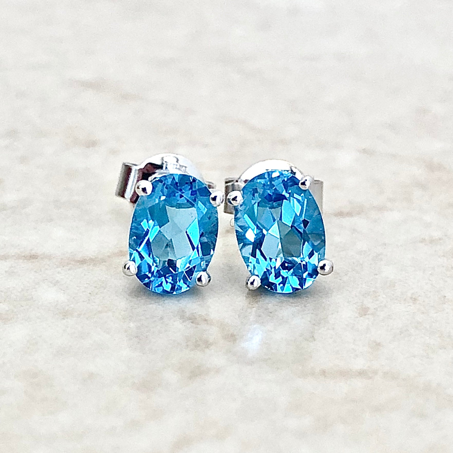 14 Karat White Gold December Birthstone Oval Blue Topaz Stud Earrings - WeilJewelry