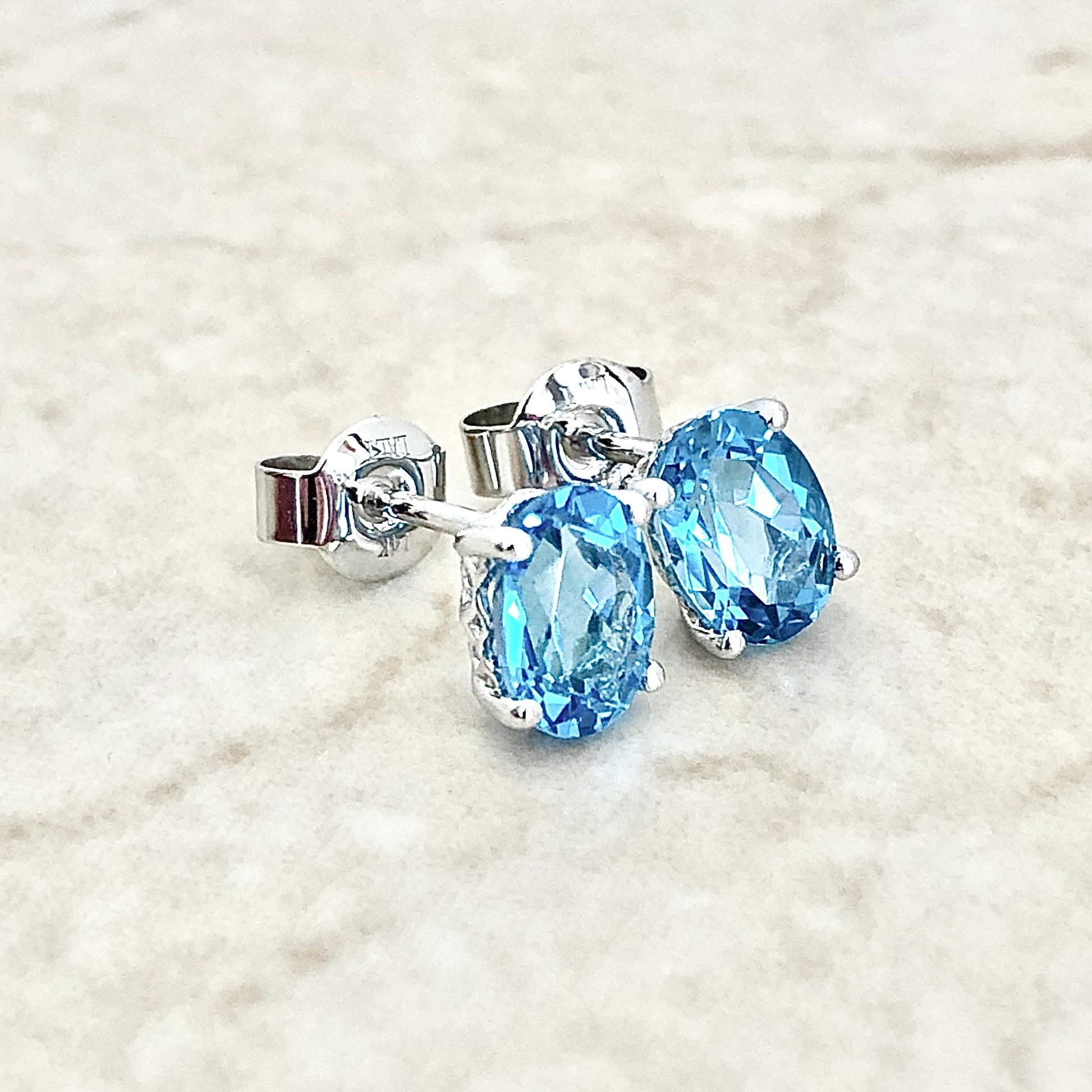 14 Karat White Gold December Birthstone Oval Blue Topaz Stud Earrings - WeilJewelry