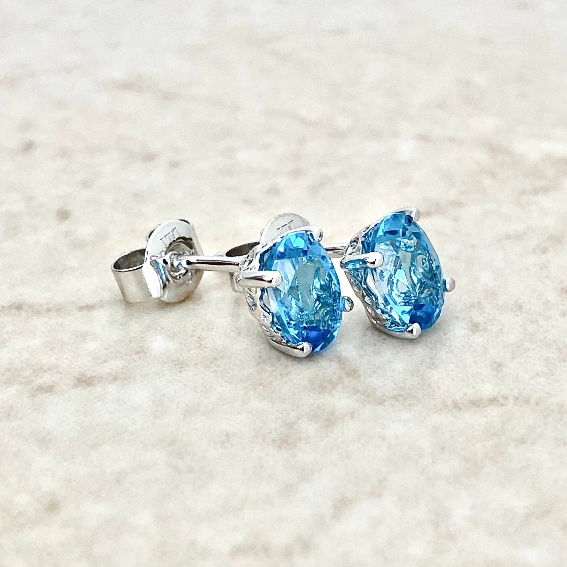 14 Karat White Gold December Birthstone Oval Blue Topaz Stud Earrings - WeilJewelry