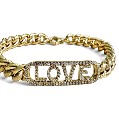 Close-up of the ZYDO Amore Dorato bracelet’s diamond LOVE letters inside an elongated diamond-set frame, joined to yellow gold curb links.