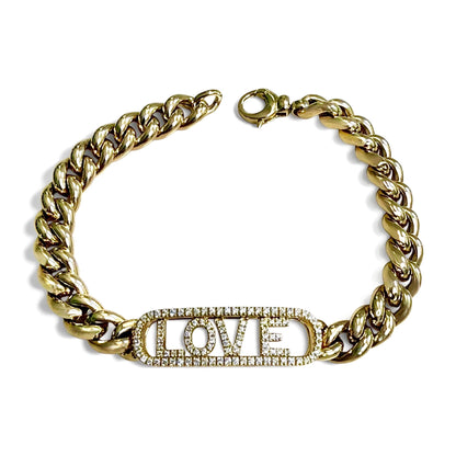 Full overhead view of the ZYDO Amore Dorato bracelet laid in a circle, with its clasp open and diamond LOVE centerpiece at the bottom.