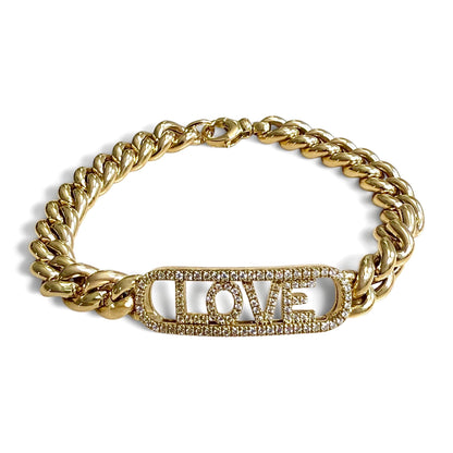 Angled view of the ZYDO Amore Dorato bracelet arranged in an oval, showing rounded yellow gold curb links and the diamond LOVE centerpiece.