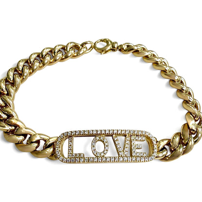 Elevated view of the ZYDO Amore Dorato bracelet, highlighting its open diamond frame, individually spaced LOVE letters and polished yellow gold chain.
