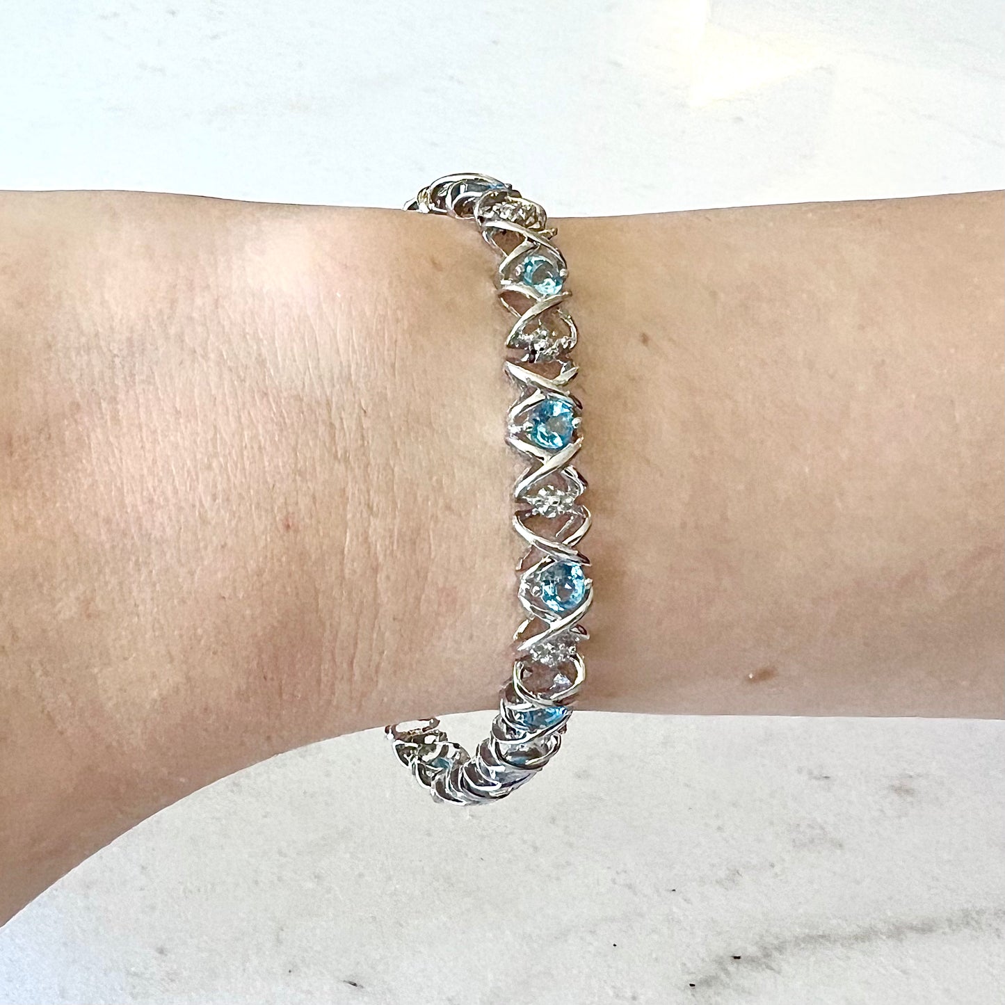 CLEARANCE 40% OFF - 10 Karat Hugs And Kisses Blue Topaz & Diamond Tennis Bracelet