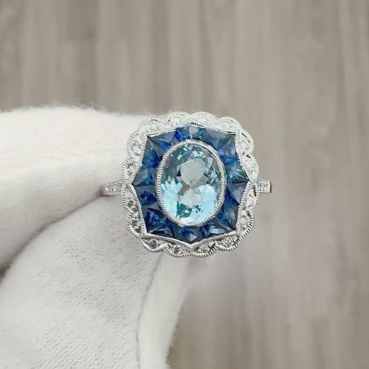 Vintage Style Handcrafted Platinum 1.17 Carat Oval Aquamarine, Sapphire & Diamond Halo Ring