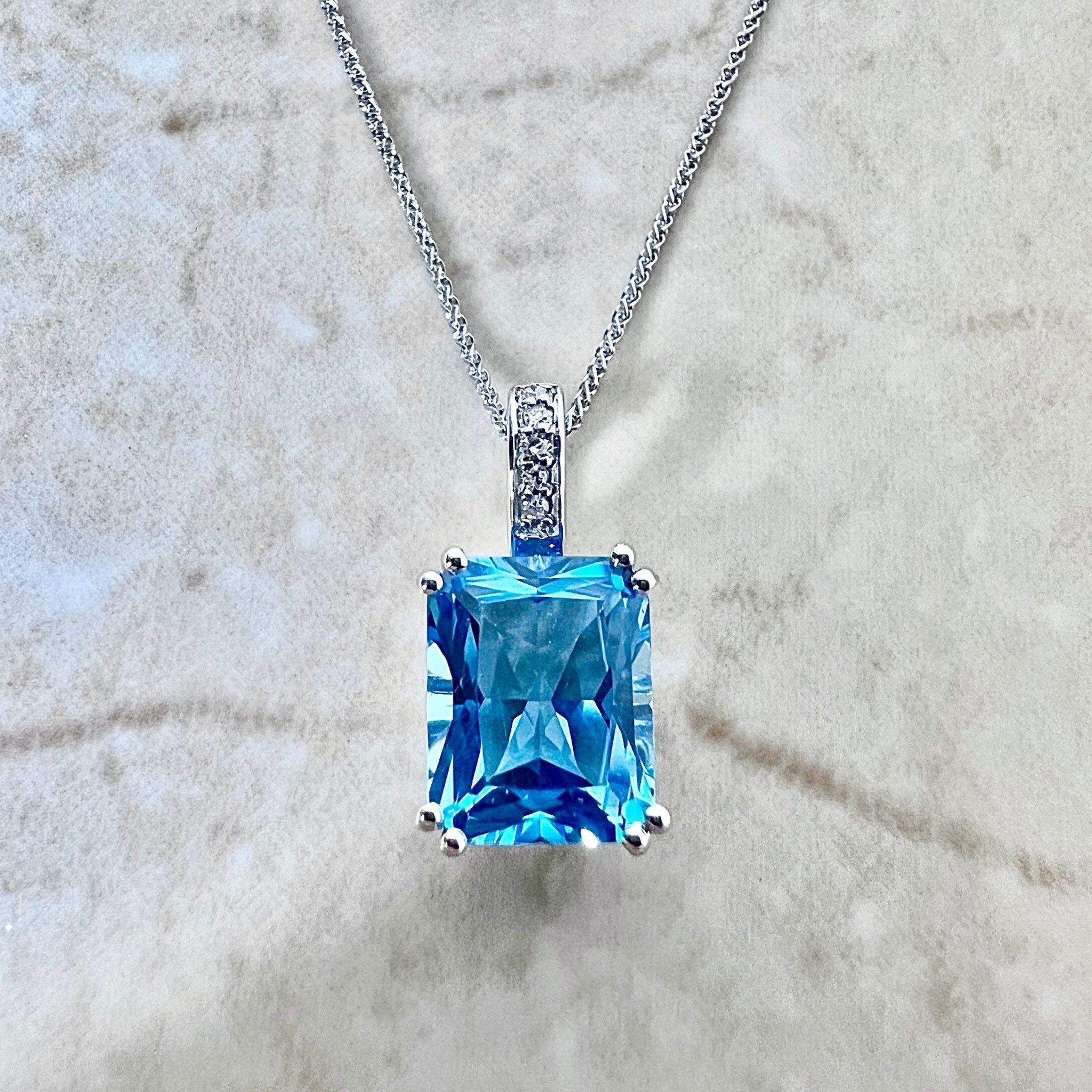 Solid 14k White Gold Swiss Blue Topaz and .05 Cttw Diamond Charm