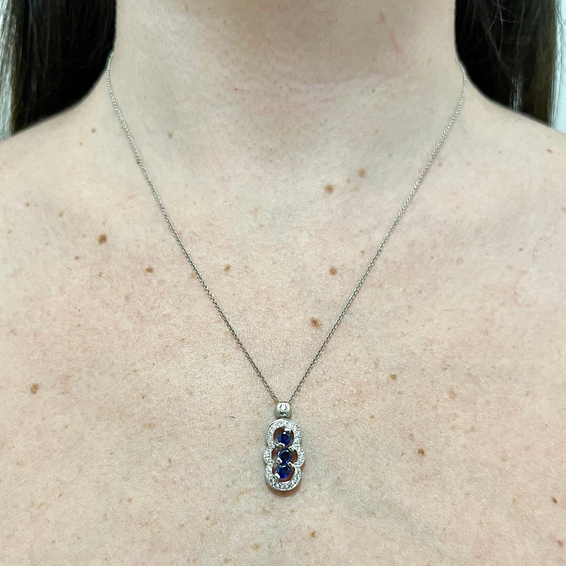 14 Karat White Gold Three - Stone Blue Sapphire & Diamond Halo Pendant Necklace - WeilJewelry