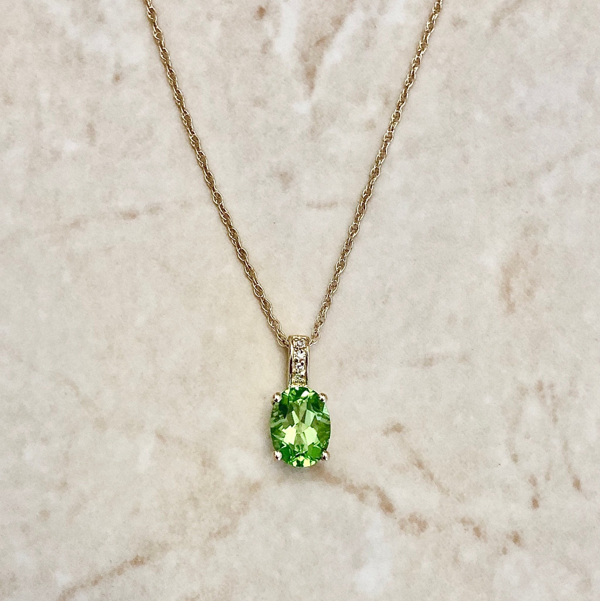 Yellow gold store peridot pendant