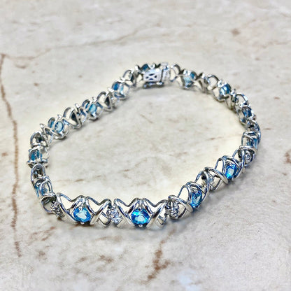 CLEARANCE 40% OFF - 10 Karat Hugs And Kisses Blue Topaz & Diamond Tennis Bracelet