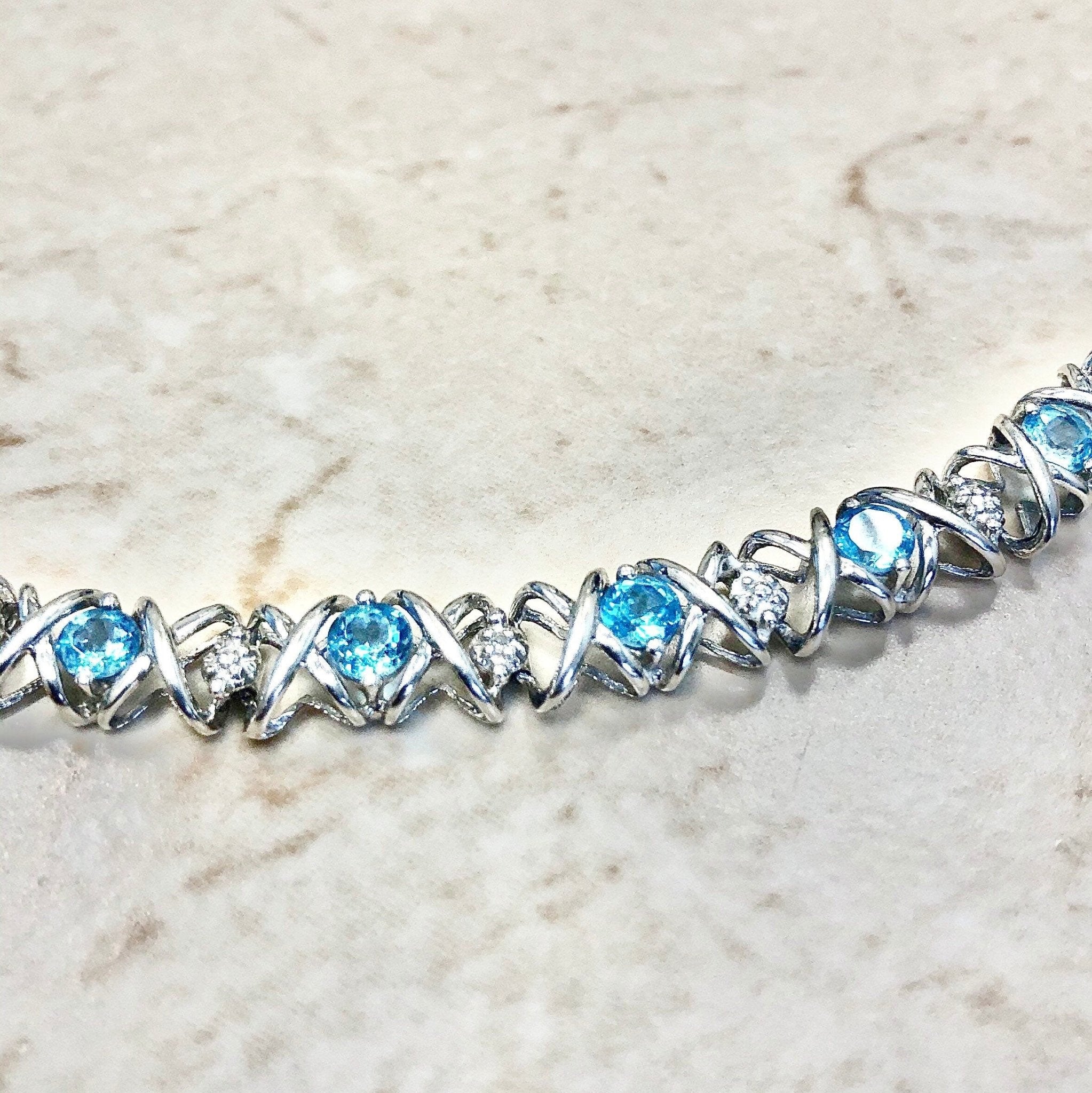 Blue Topaz Emerald Cut Tennis Bracelet in 14k Gold