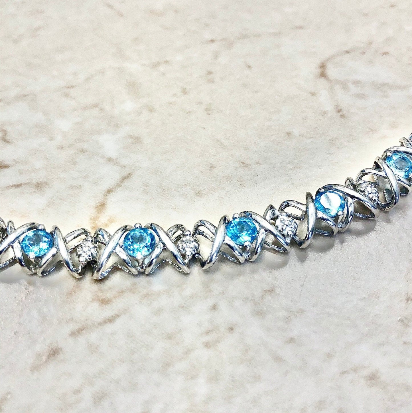 CLEARANCE 40% OFF - 10 Karat Hugs And Kisses Blue Topaz & Diamond Tennis Bracelet - WeilJewelry