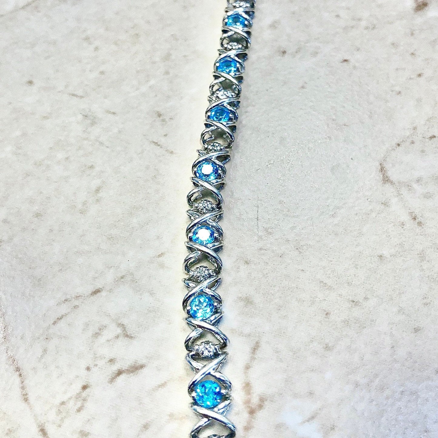 CLEARANCE 40% OFF - 10 Karat Hugs And Kisses Blue Topaz & Diamond Tennis Bracelet - WeilJewelry